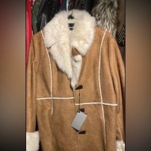 Fur jacket ,suede material as well.